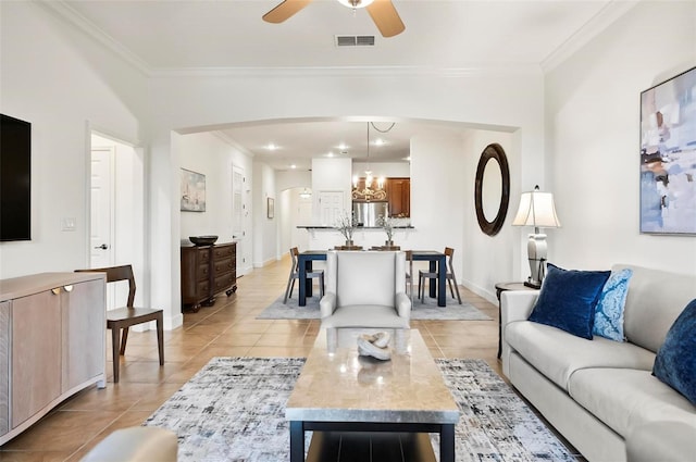 200 Cinnamon Beach Way Unit 122, Palm Coast, FL 32137 - living room featuring ornamental molding, light tile patterned floors, a ceiling fan, a chandelier, and arched walkways