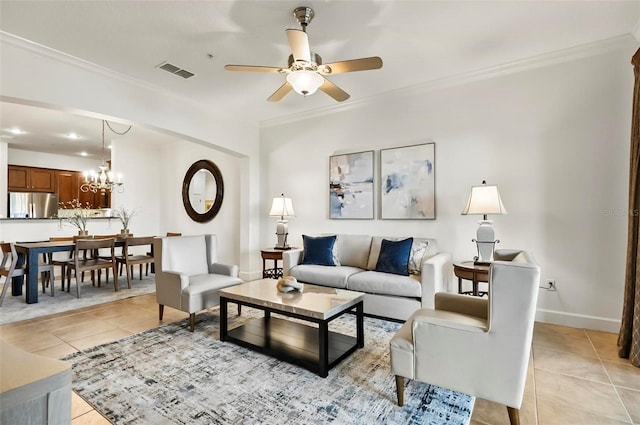 200 Cinnamon Beach Way Unit 122, Palm Coast, FL 32137 - living room featuring ornamental molding, light tile patterned flooring, ceiling fan, a chandelier, and baseboards
