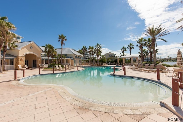 200 Cinnamon Beach Way Unit 122, Palm Coast, FL 32137 - community pool featuring a patio
