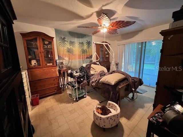 tiled bedroom with ceiling fan