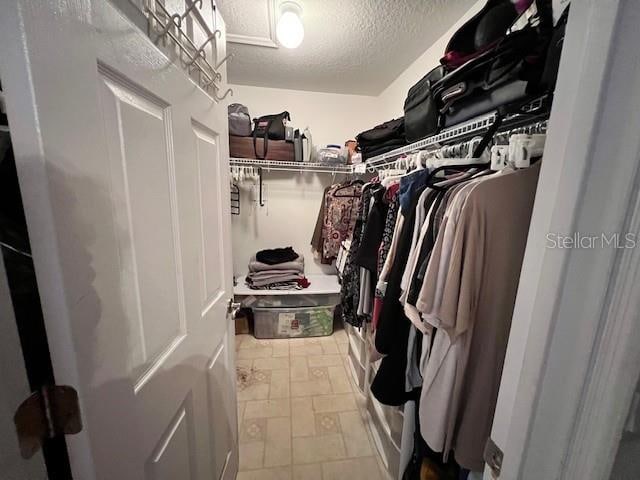 walk in closet featuring tile patterned floors