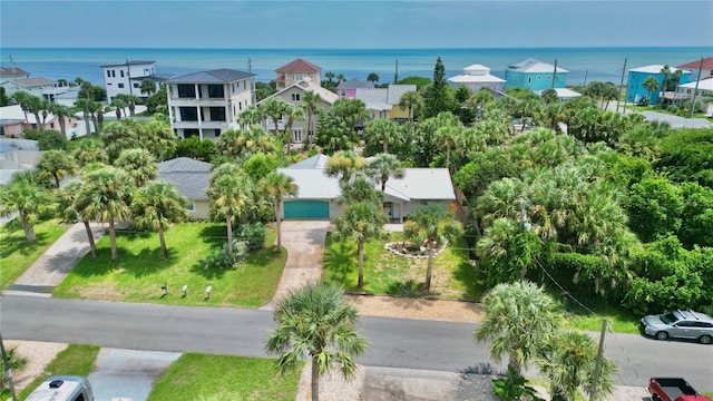 drone / aerial view with a water view and a residential view