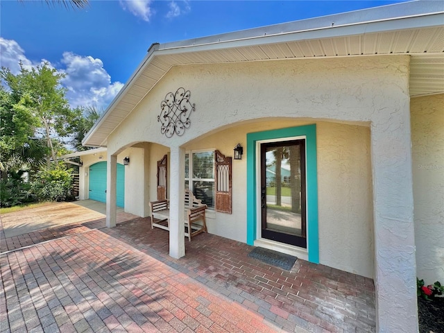 property entrance featuring a garage