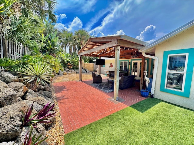 view of patio with ceiling fan and a pergola