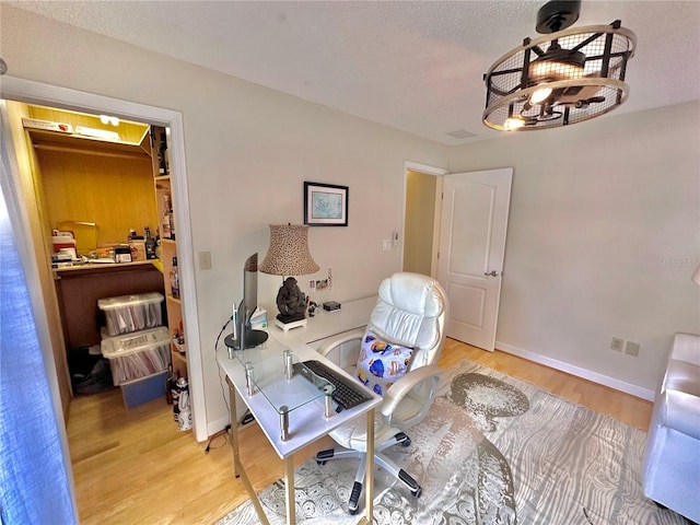 home office featuring hardwood / wood-style floors