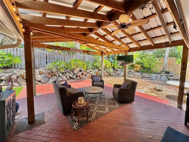 view of patio featuring ceiling fan