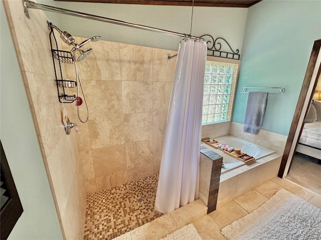 bathroom with tile patterned floors and separate shower and tub