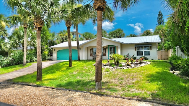 ranch-style home featuring a front yard and a garage