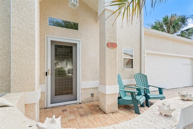 property entrance with a garage