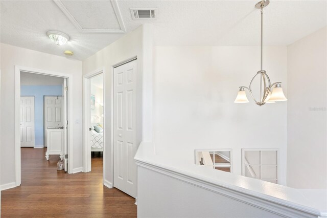 hallway featuring wood-type flooring