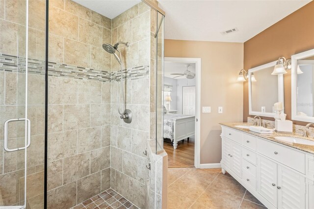 bathroom featuring walk in shower, ceiling fan, hardwood / wood-style floors, and double vanity