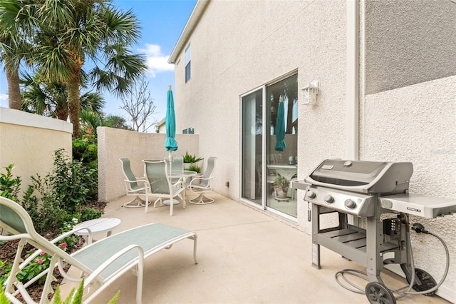 view of patio featuring a grill