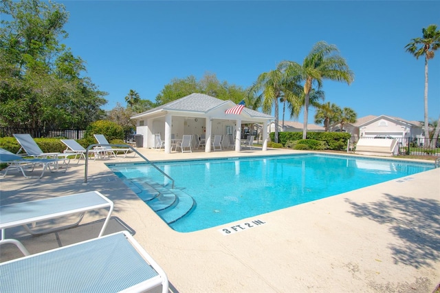 view of swimming pool featuring a patio area