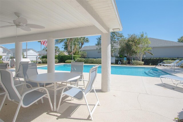 view of swimming pool with a patio and ceiling fan