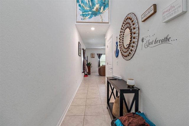 hallway with light tile patterned floors