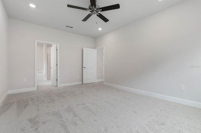 unfurnished bedroom featuring light colored carpet and ceiling fan