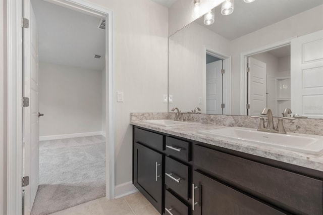 bathroom with vanity and tile patterned floors