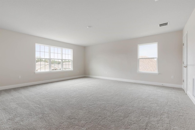 empty room featuring light colored carpet