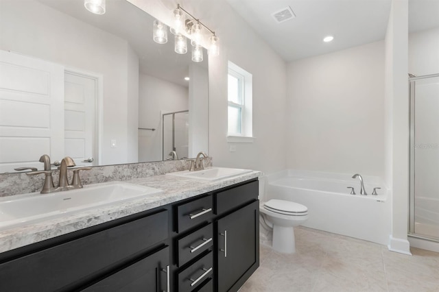 full bathroom featuring tile patterned flooring, vanity, toilet, and separate shower and tub