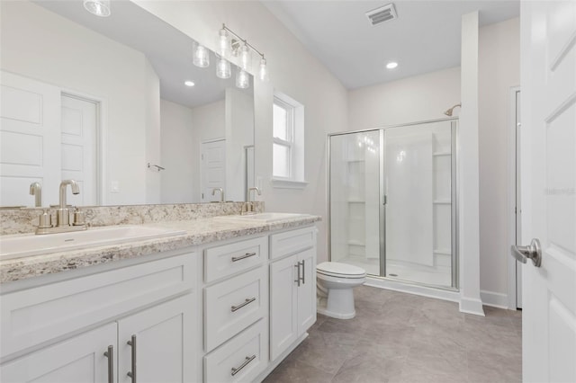 full bath with a sink, visible vents, toilet, and a shower stall