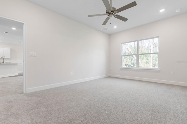 unfurnished room featuring recessed lighting, visible vents, light carpet, and baseboards