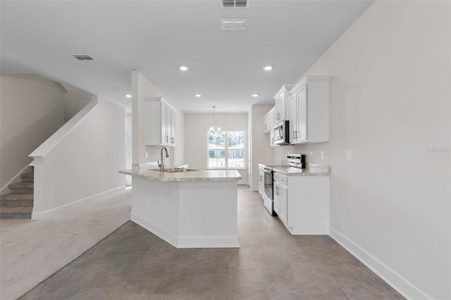 kitchen with a sink, light stone counters, stainless steel appliances, white cabinets, and baseboards