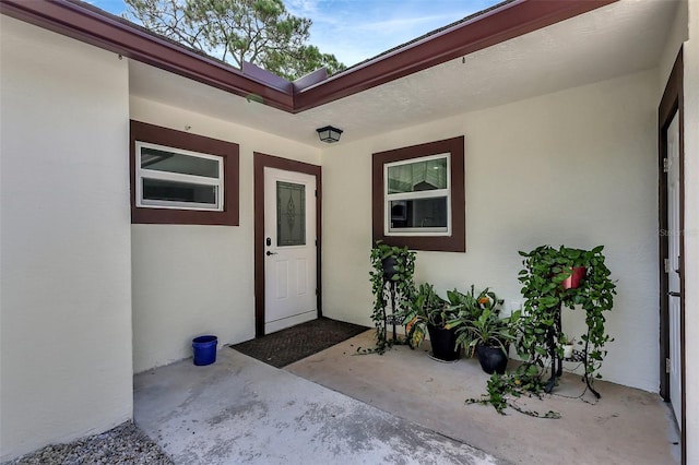 doorway to property featuring a patio area