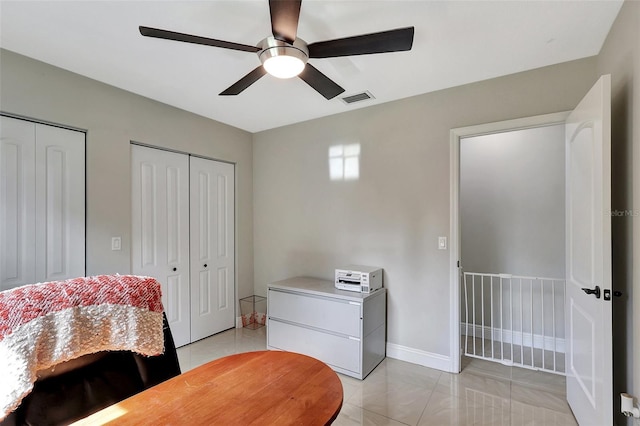 interior space featuring ceiling fan