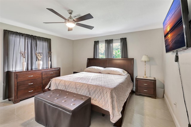 bedroom featuring ornamental molding and ceiling fan