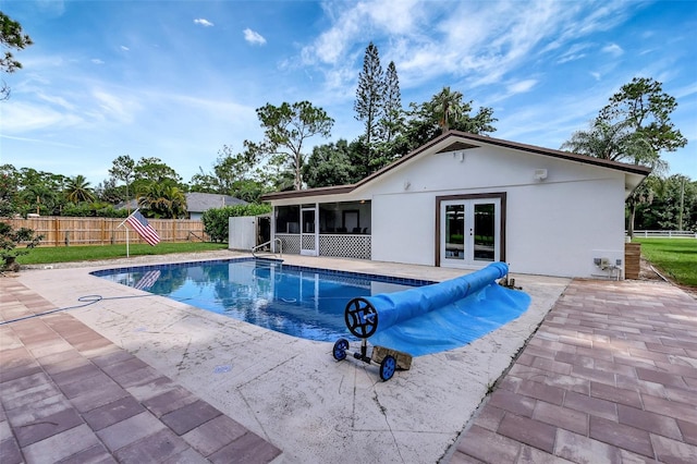 view of pool featuring a patio and french doors