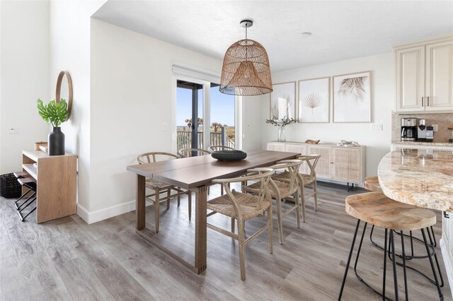 dining space featuring light hardwood / wood-style flooring