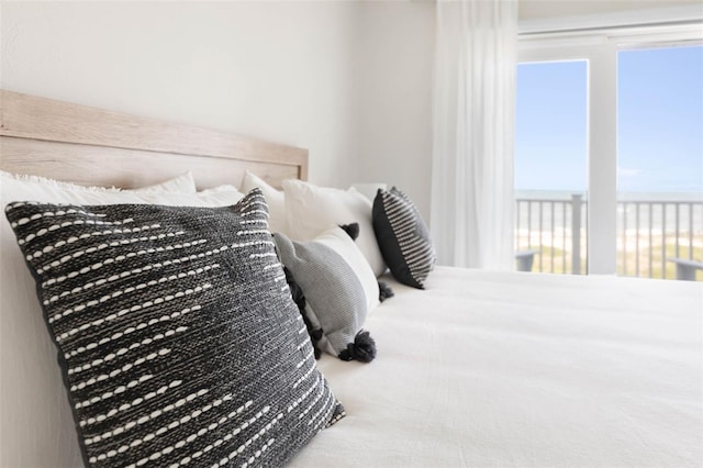 bedroom featuring a water view