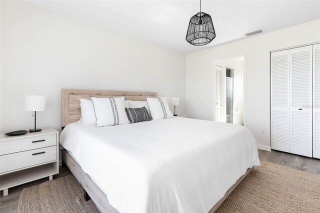 bedroom featuring light hardwood / wood-style flooring and a closet