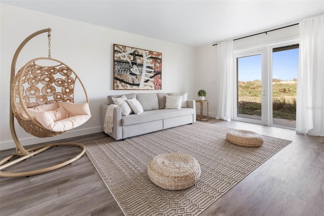 living room featuring baseboards and wood finished floors