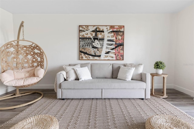 living area with wood finished floors and baseboards