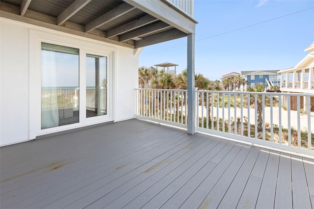 wooden terrace with a water view