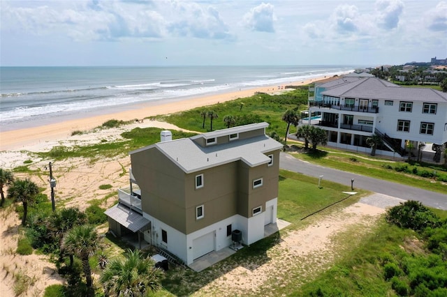 aerial view with a beach view and a water view