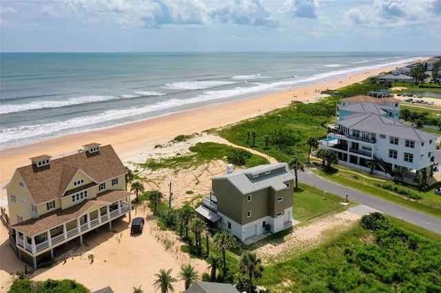 bird's eye view with a beach view and a water view