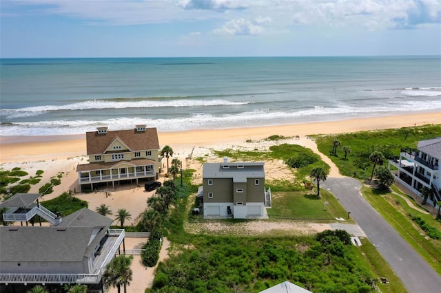 aerial view featuring a water view and a beach view