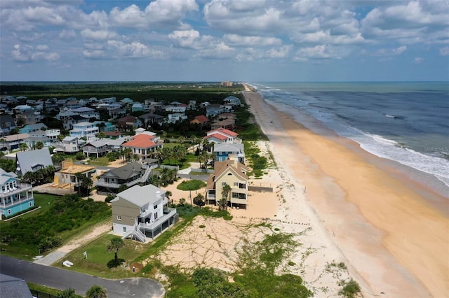 bird's eye view with a beach view and a water view