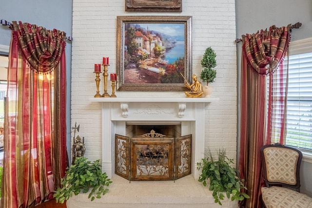 living area with brick wall