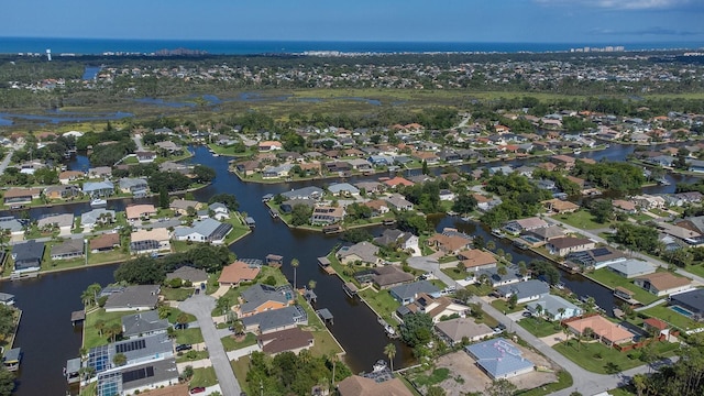 aerial view with a residential view and a water view