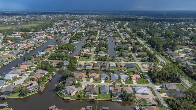 aerial view with a water view and a residential view