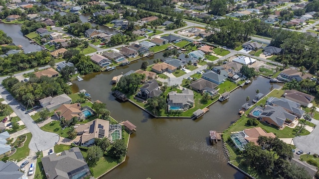 birds eye view of property with a residential view and a water view