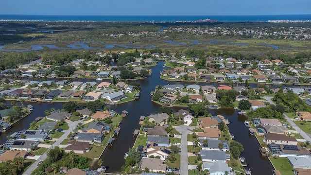 aerial view featuring a residential view and a water view