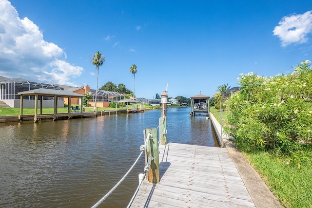 view of dock with a water view and a gazebo