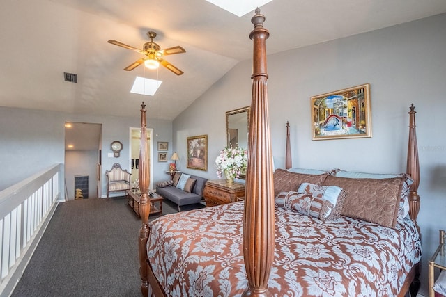 bedroom featuring lofted ceiling with skylight, carpet flooring, and visible vents