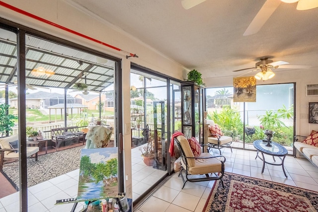 sunroom with a ceiling fan