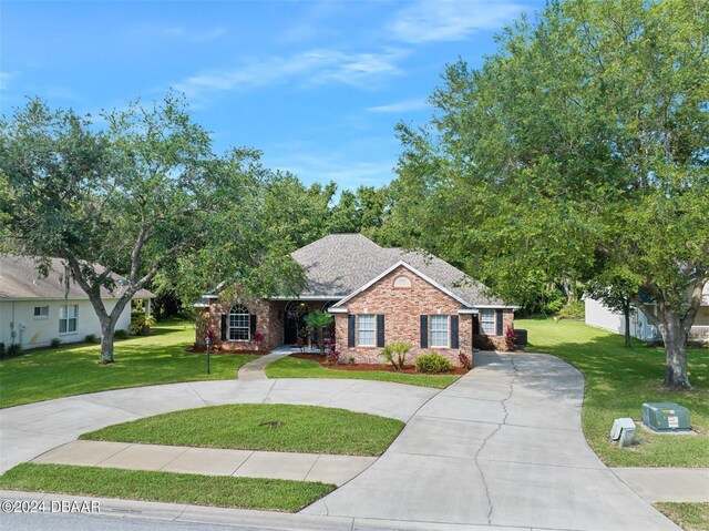 single story home with a front yard