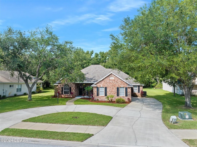 ranch-style house with a front lawn